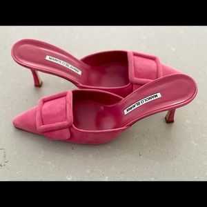 Manolo Blahnik pink suede mules.